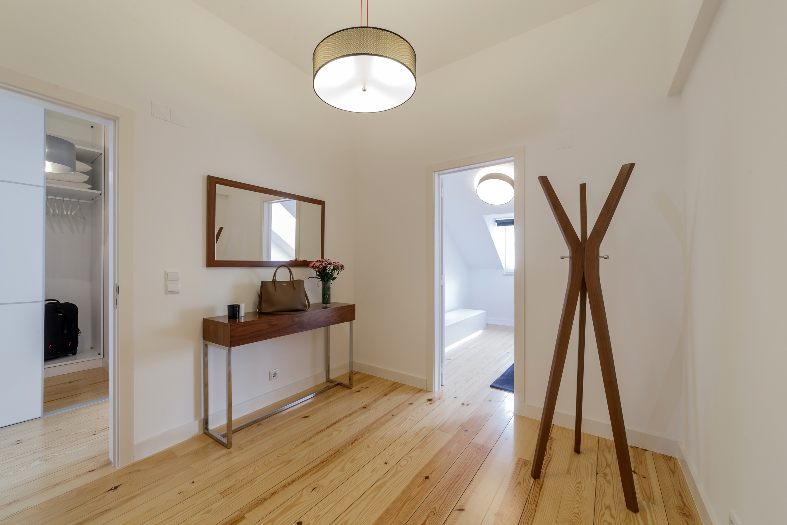 Modern apartment with white walls and light wooden floor City center studio